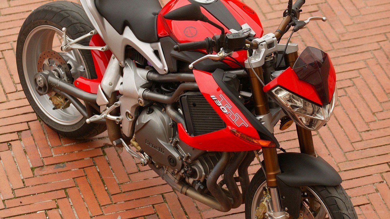 red sport motorcycle on brick