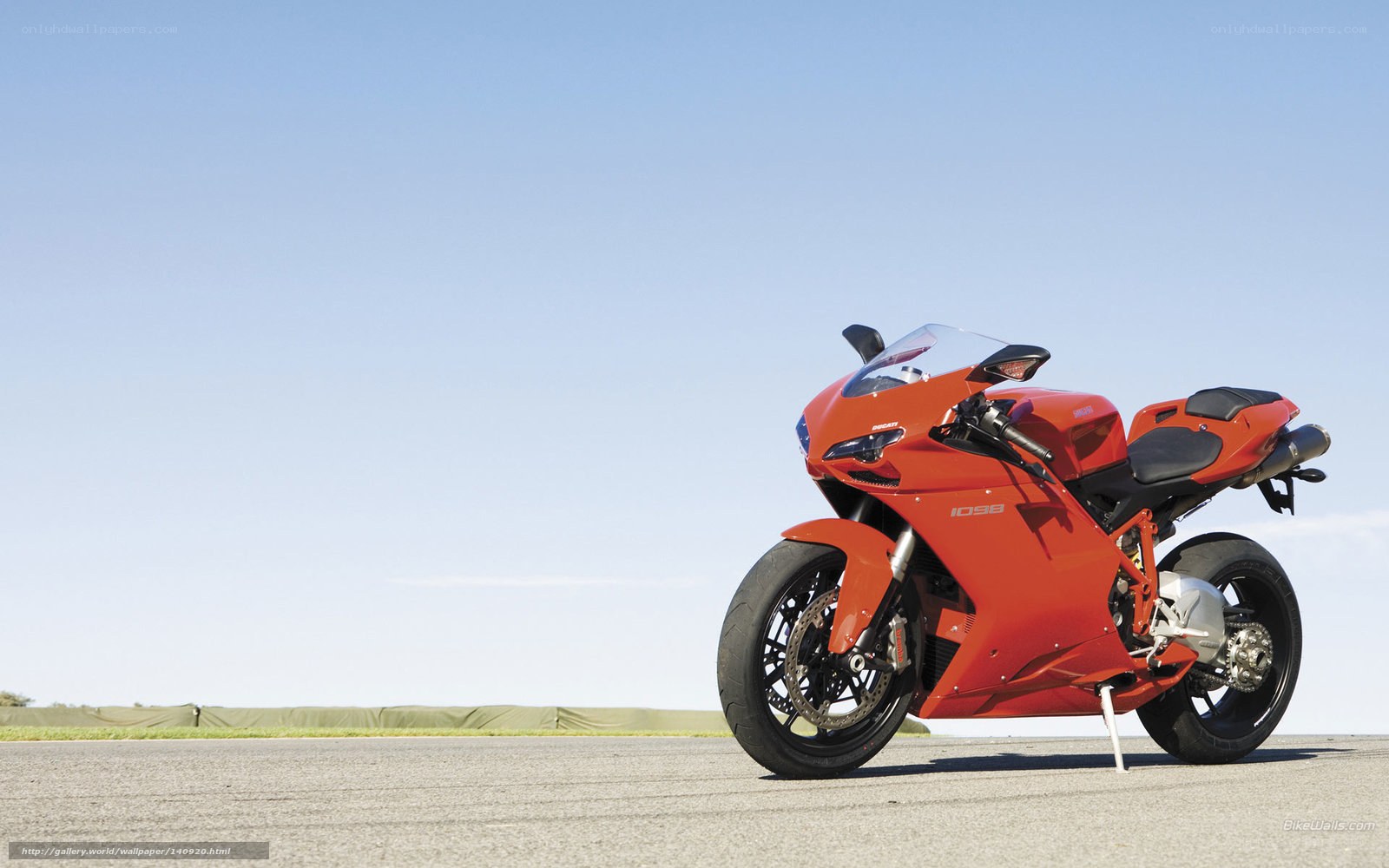 Red sport motorcycle on track