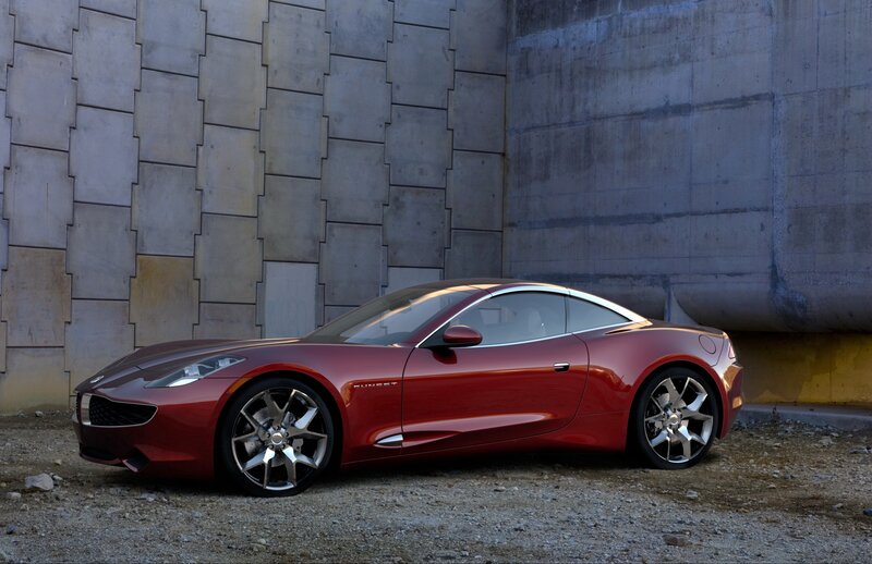 Red sports car against concrete wall