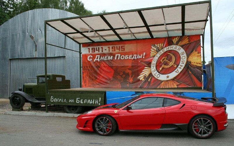 Red Sports Car and Military Truck
