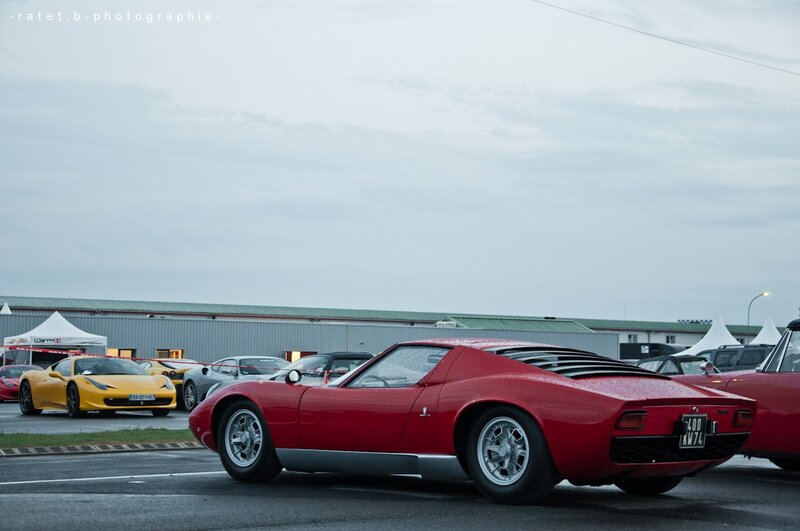 Red sports car at a car show
