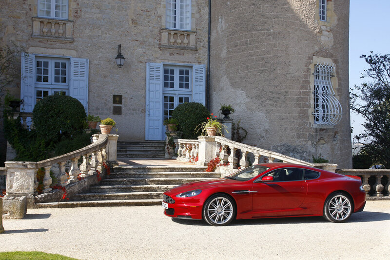 Red sports car at a chateau