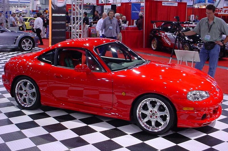 Red sports car at auto show