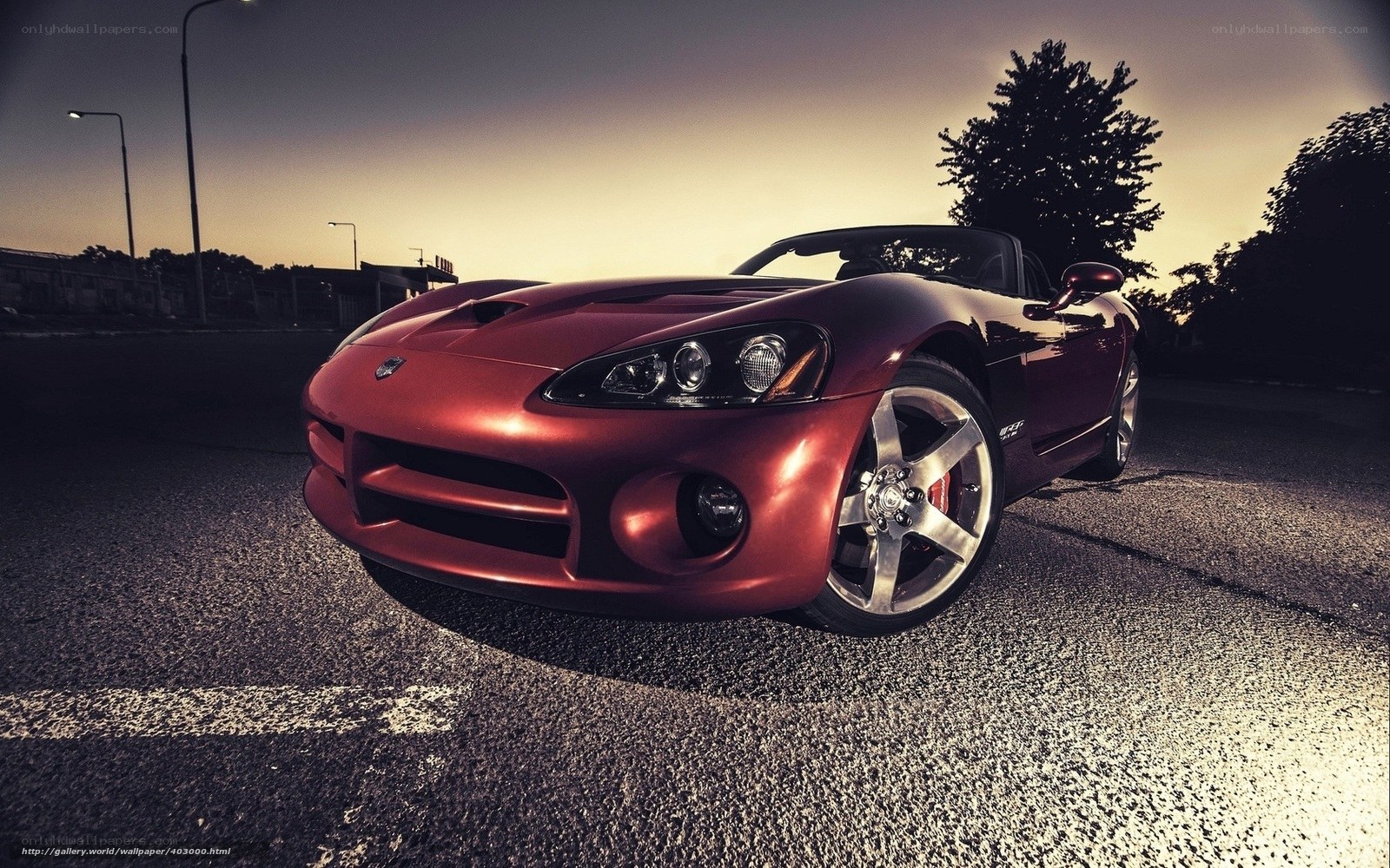 Red sports car at dusk