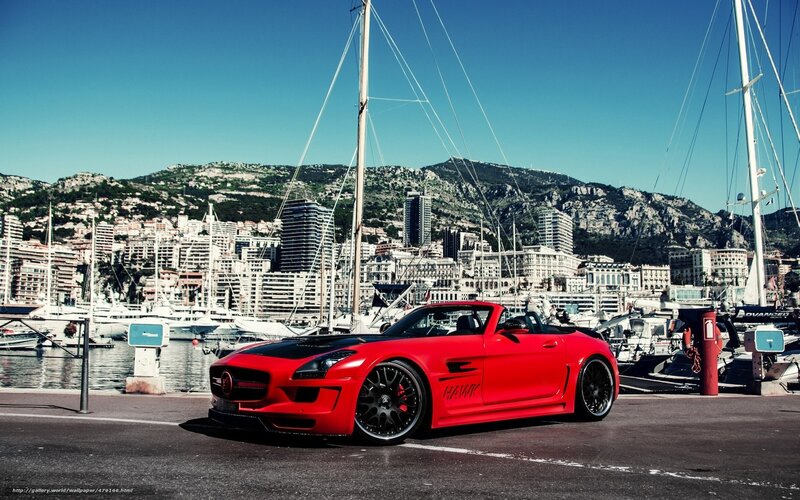 Red sports car at marina