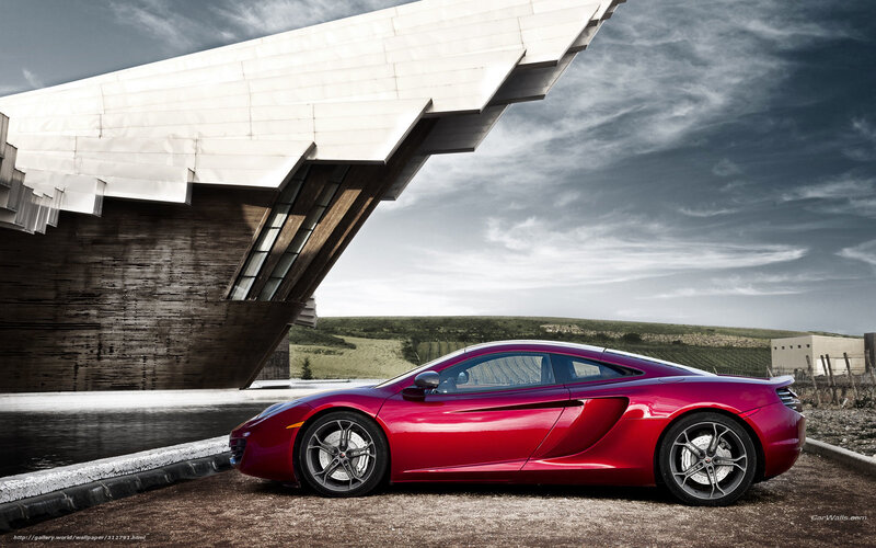 Red sports car at modern building