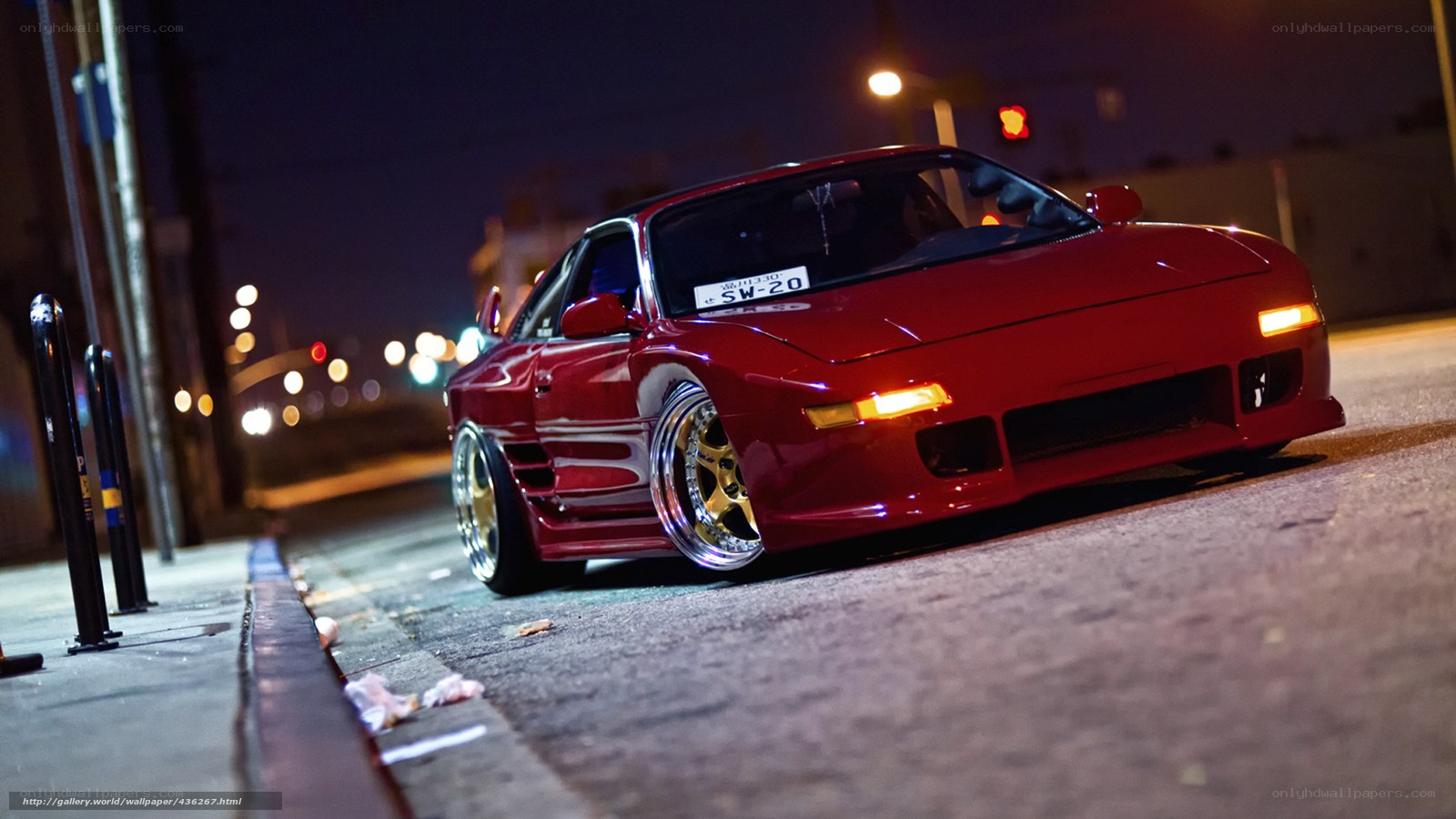 Red sports car at night