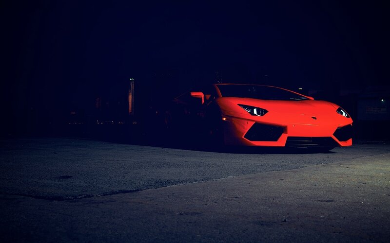 Red sports car at night