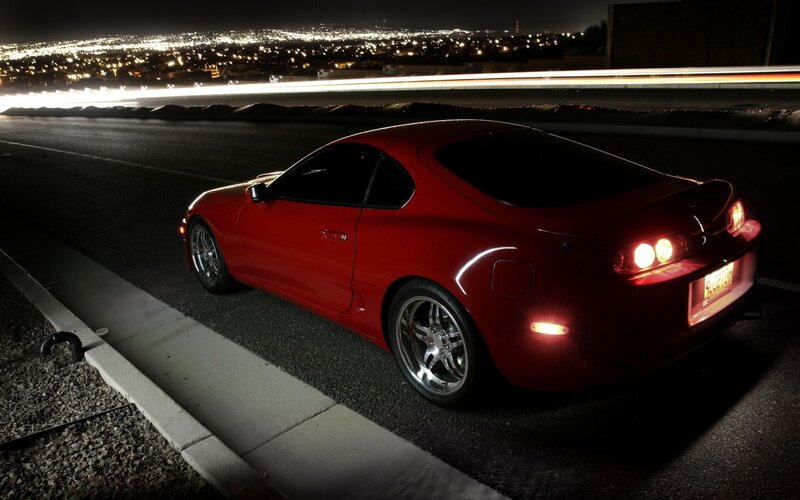 Red sports car at night
