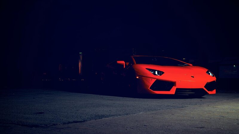 Red sports car at night