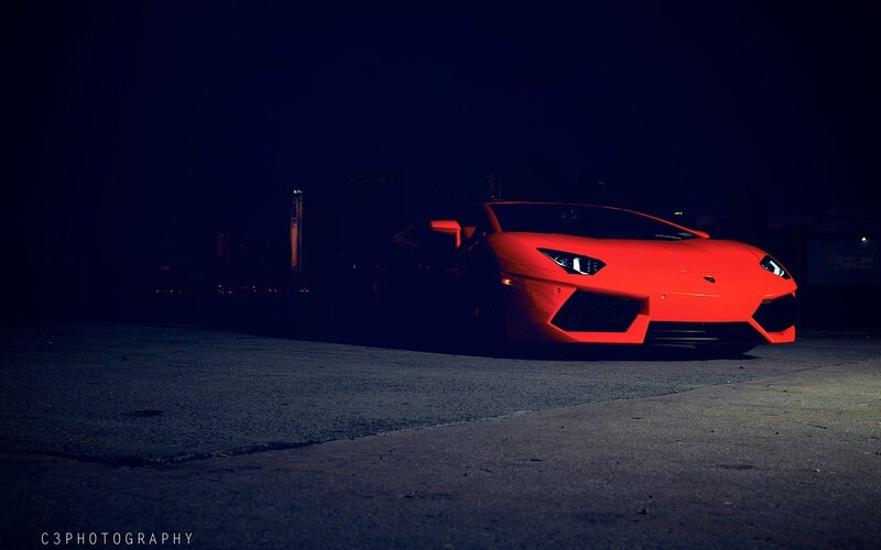 Red sports car at night