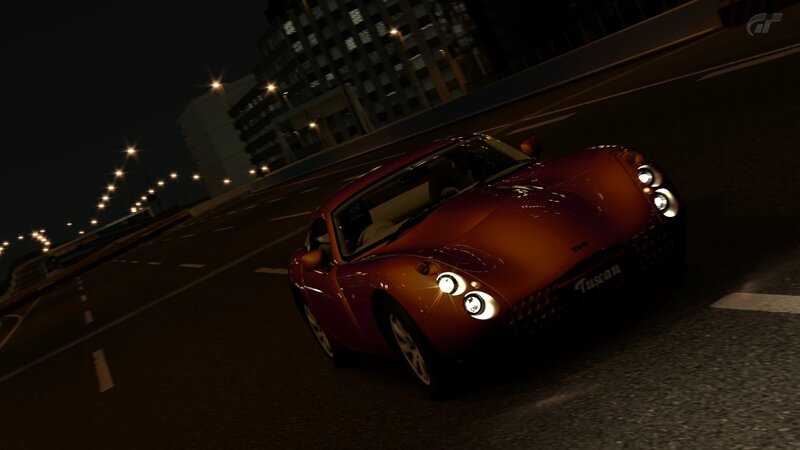 red sports car at night