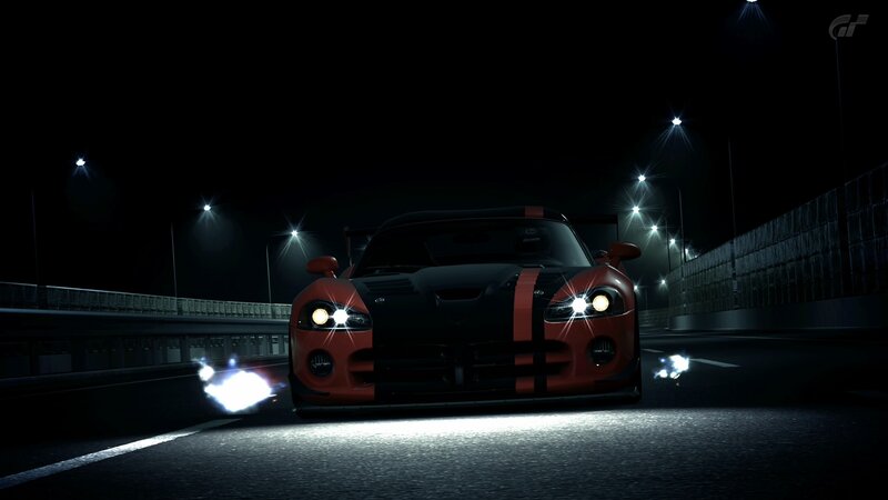 Red sports car at night