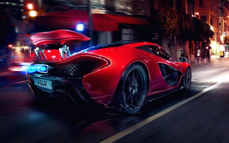 Red sports car at night