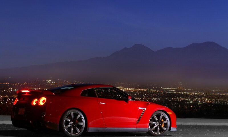 Red sports car at night