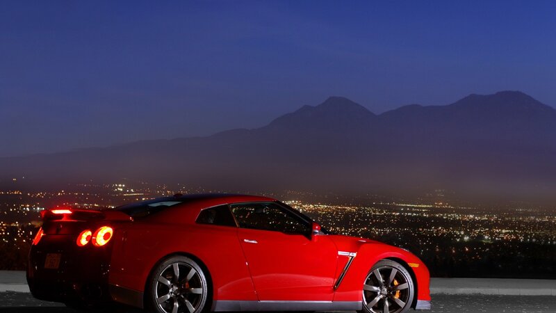 Red sports car at night