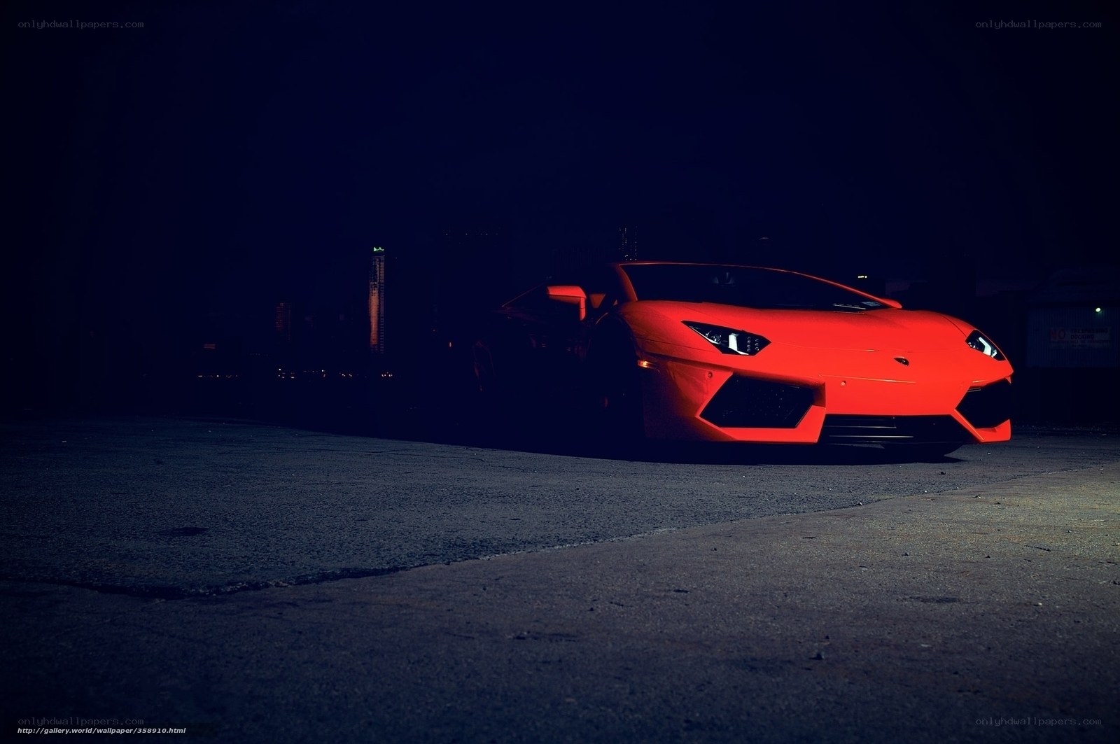 Red sports car at night
