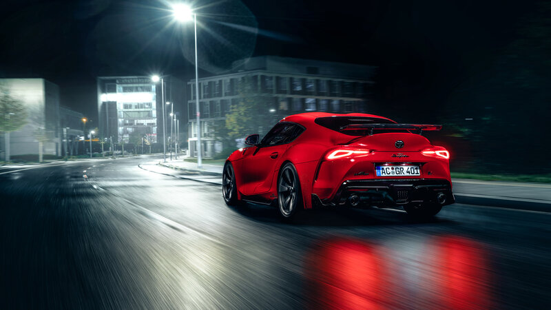 Red Sports Car at Night — Dramatic, Photograph, Streetlights, Buildings