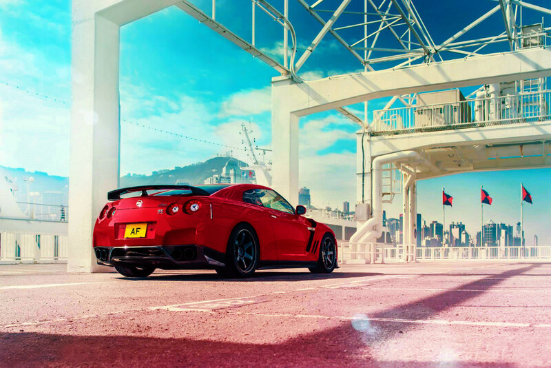 Red sports car at port