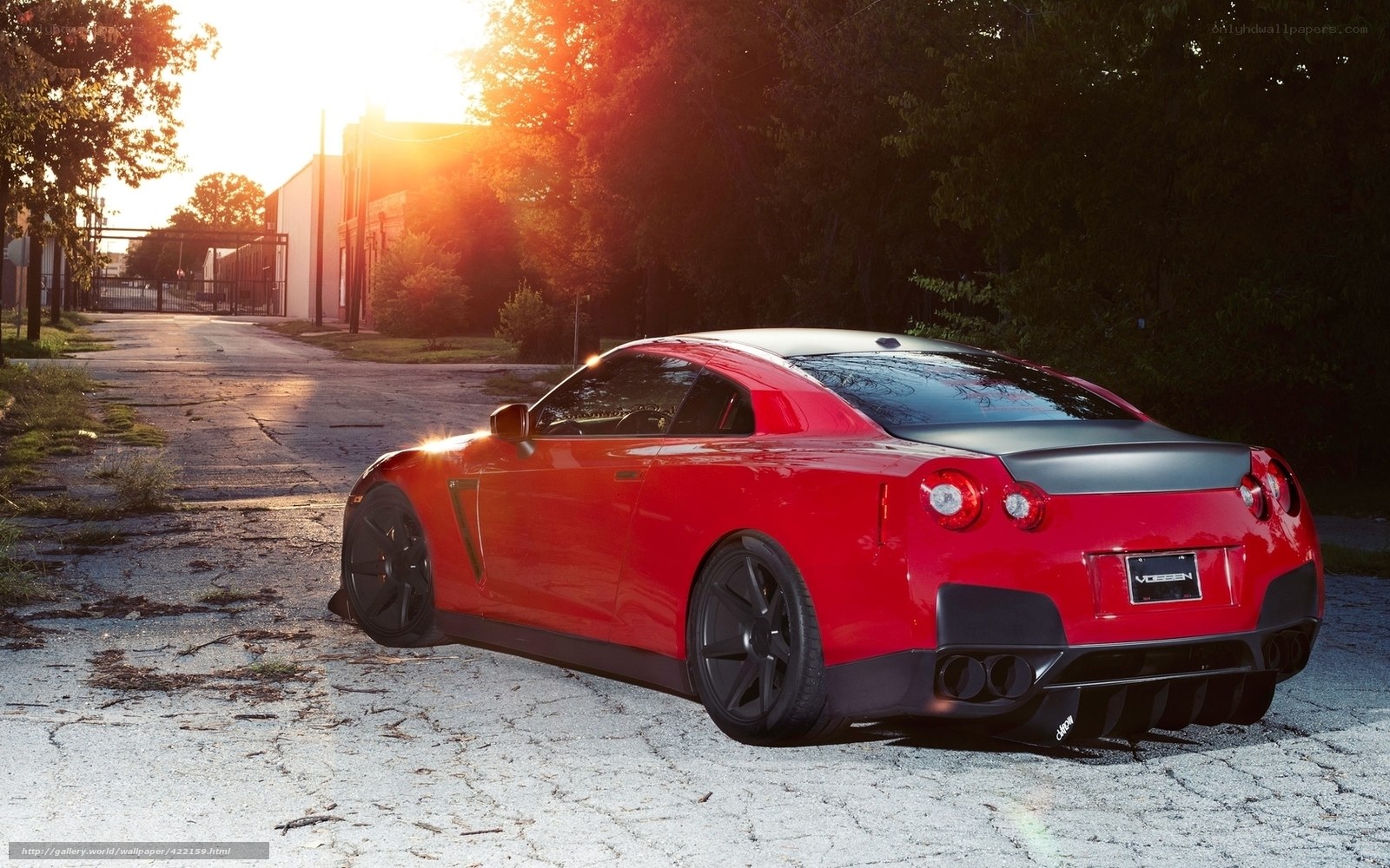 red sports car at sunset