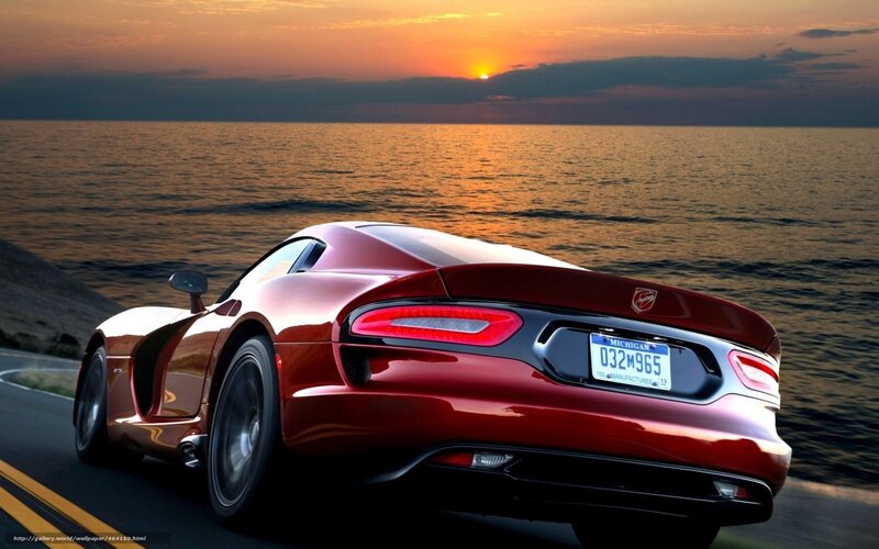 Red sports car at sunset