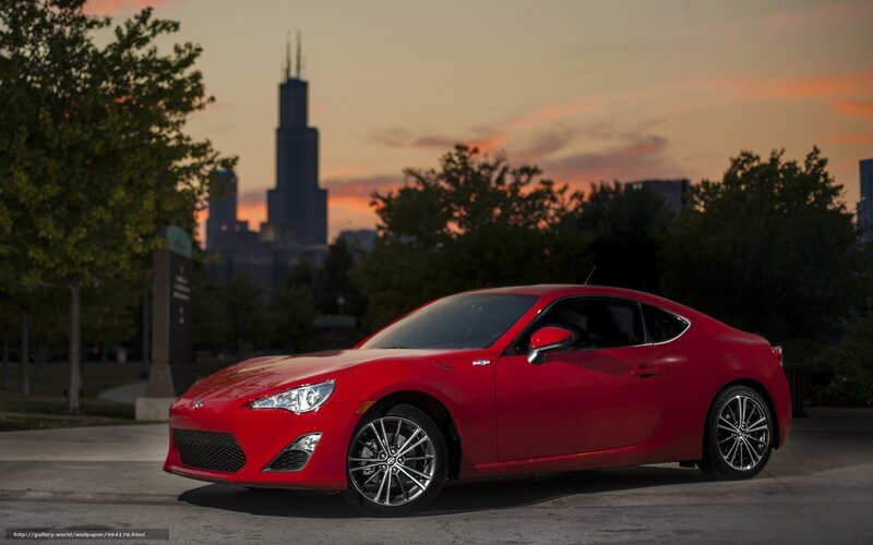 Red sports car at sunset