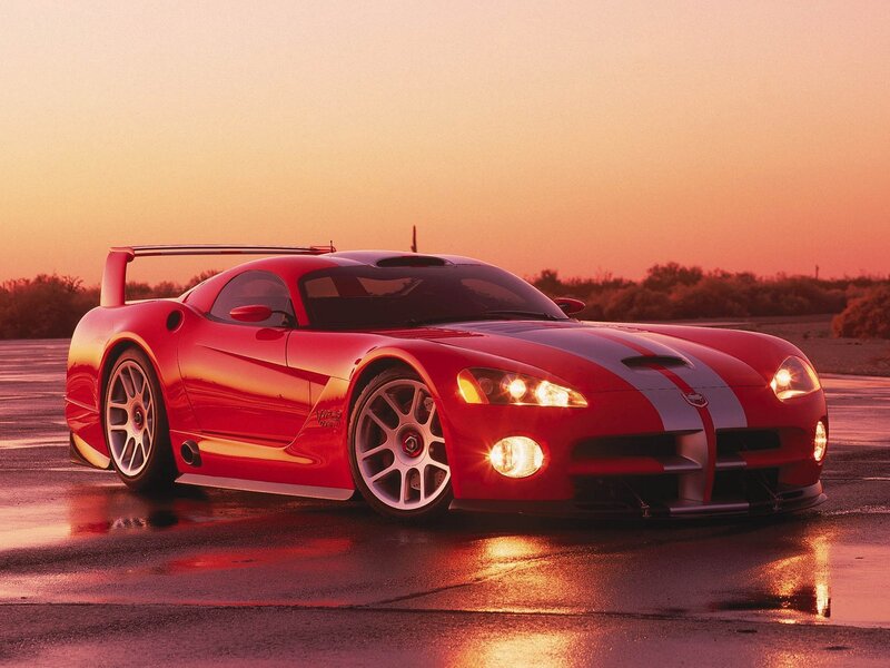 Red sports car at sunset