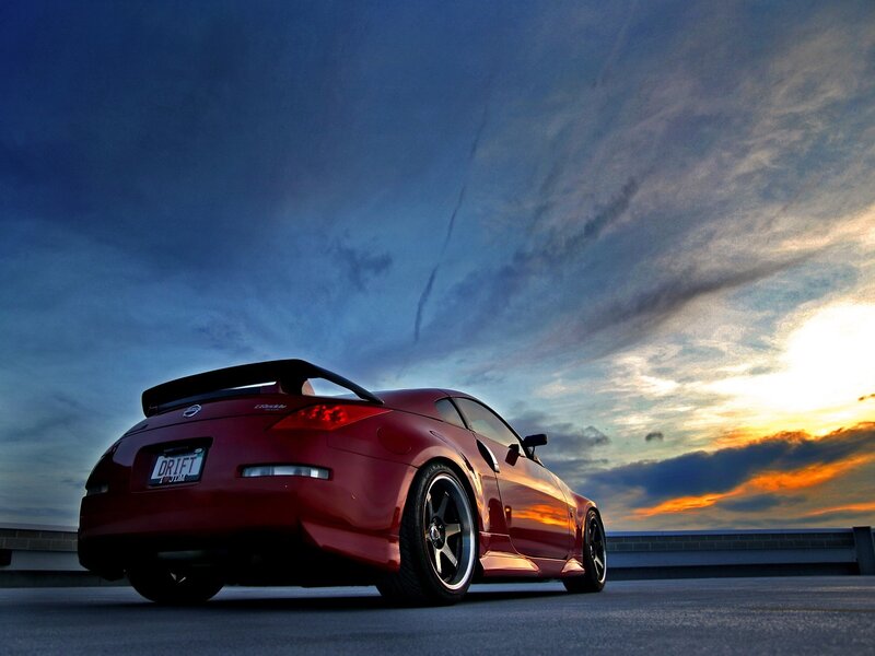 Red sports car at sunset