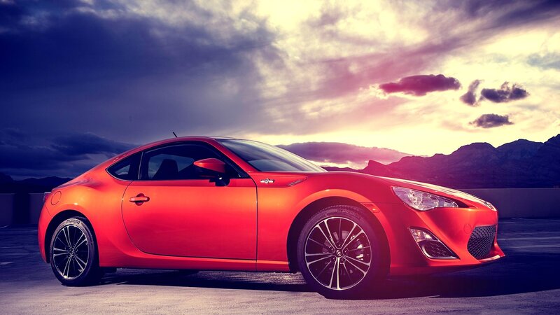 Red sports car at sunset