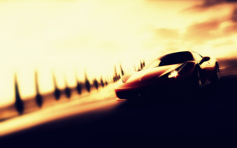 Red sports car at sunset