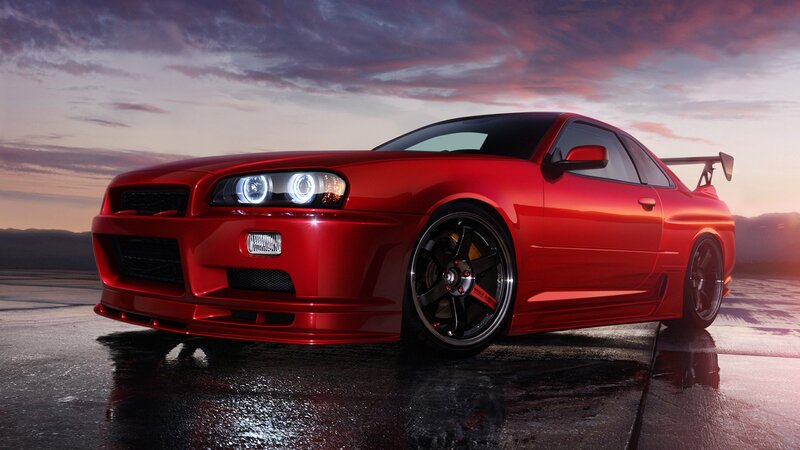 Red sports car at sunset