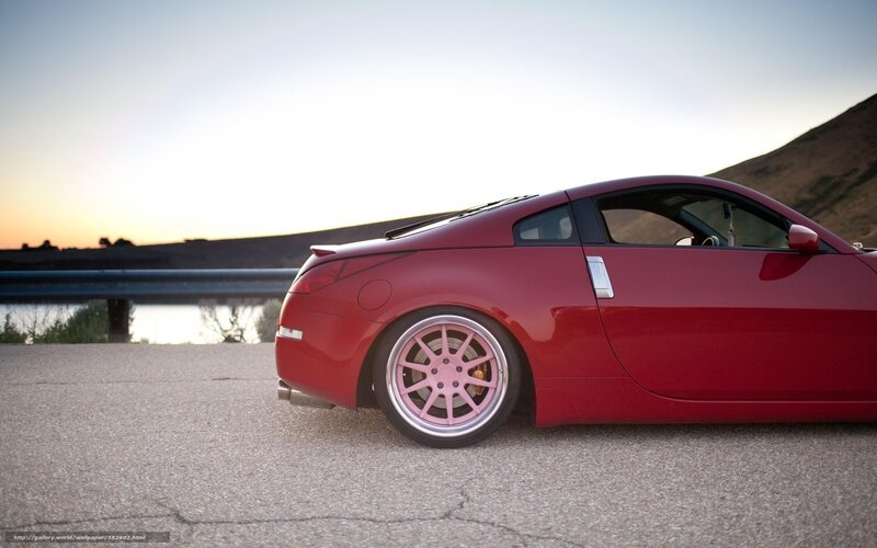Red sports car at sunset