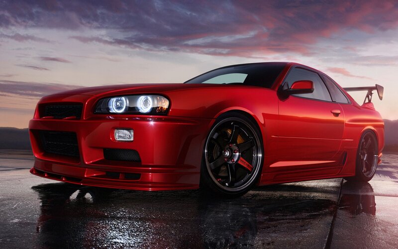 Red sports car at sunset