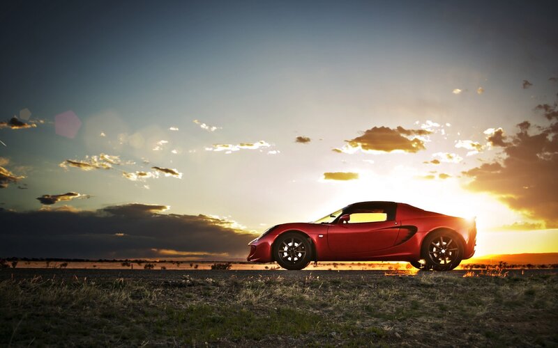 Red sports car at sunset