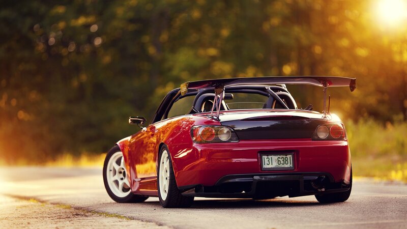 red sports car at sunset