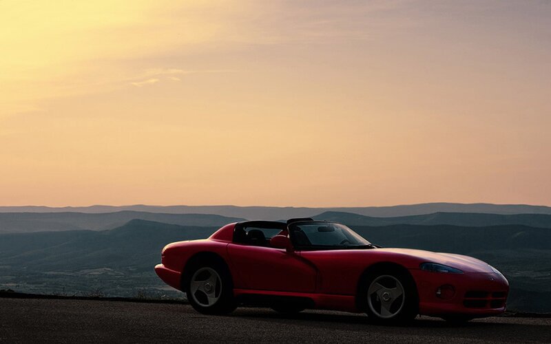 Red sports car at sunset