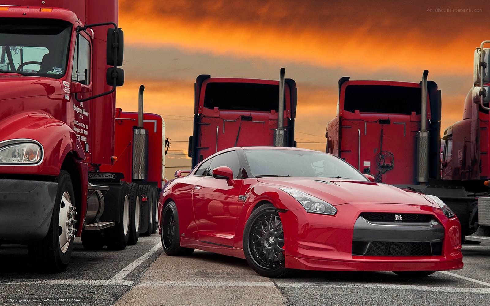Red sports car between trucks