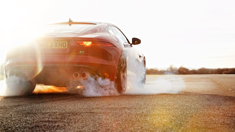 Red Sports Car Burning Rubber