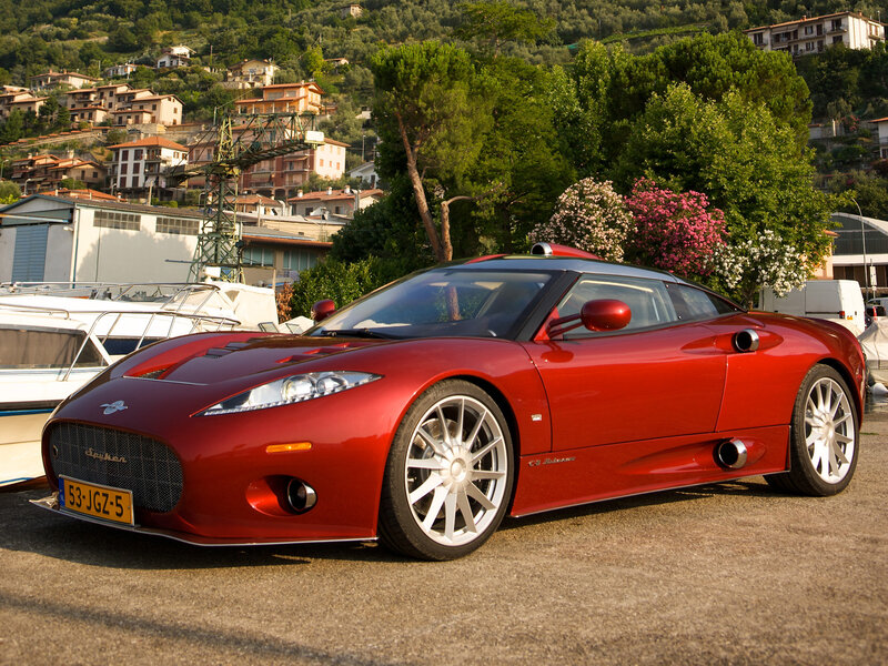 Red sports car by the water