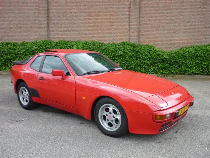 Red Sports Car — Calm, Afternoon, Photograph, Brick Wall