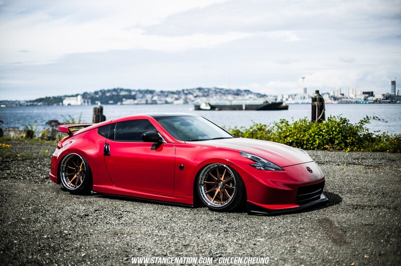 Red Sports Car — Calm, Afternoon, Photograph, City Skyline, Water