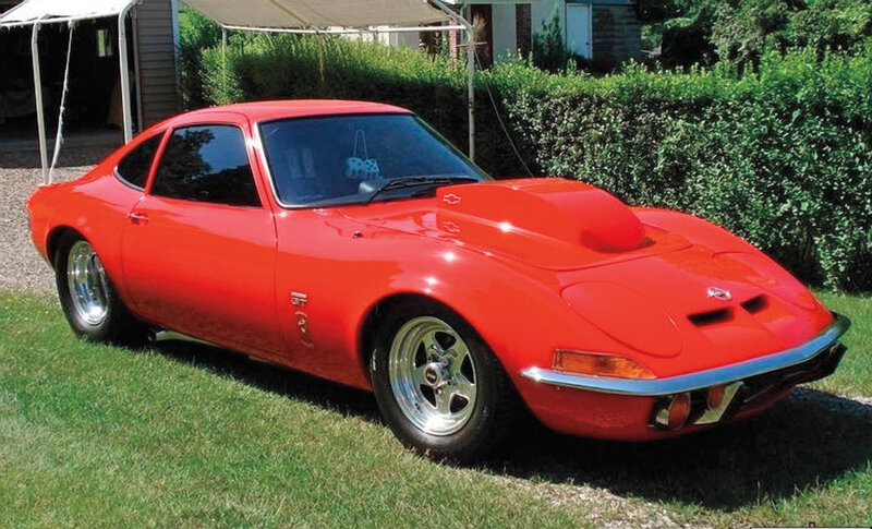 Red Sports Car — Calm, Afternoon, Photograph, Grass, Hedge