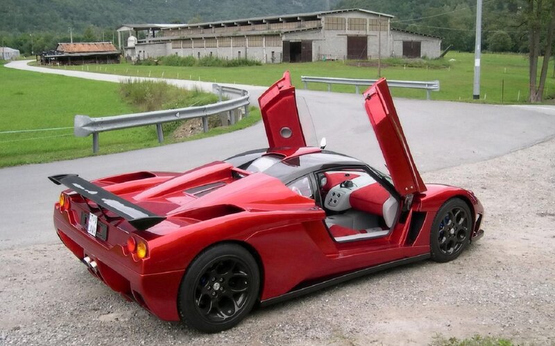 Red Sports Car — Calm, Afternoon, Photograph, Road, Building