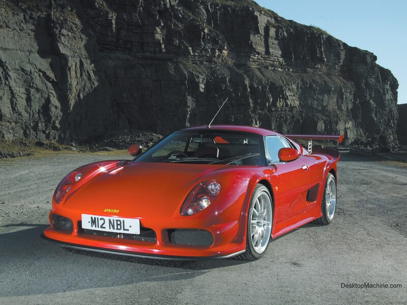 Red Sports Car — Dramatic, Afternoon, Photograph, Cliff, Road, Antenna