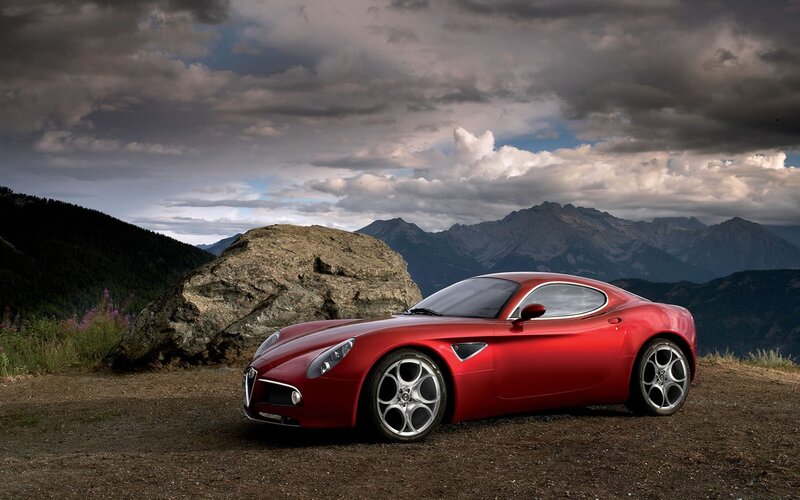Red Sports Car — Dramatic, Afternoon, Photograph, Mountains, Rock, Clouds