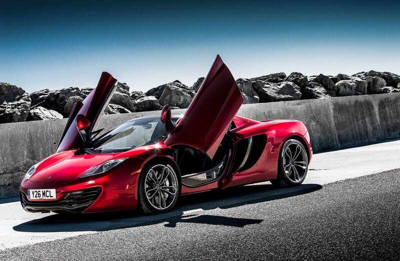 Red Sports Car — Dramatic, Afternoon, Photograph, Open Doors, Rocks