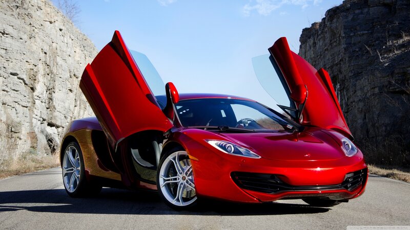 Red Sports Car — Dramatic, Afternoon, Photograph, Open Doors, Rocky Cliffs
