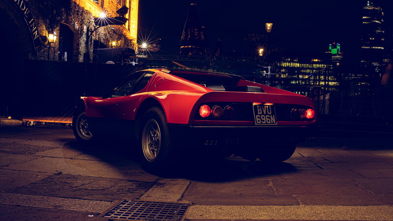 Red Sports Car — Dramatic, Night, Photograph, Building, City Lights