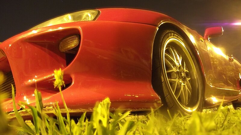 Red Sports Car — Dramatic, Night, Photograph, Grass