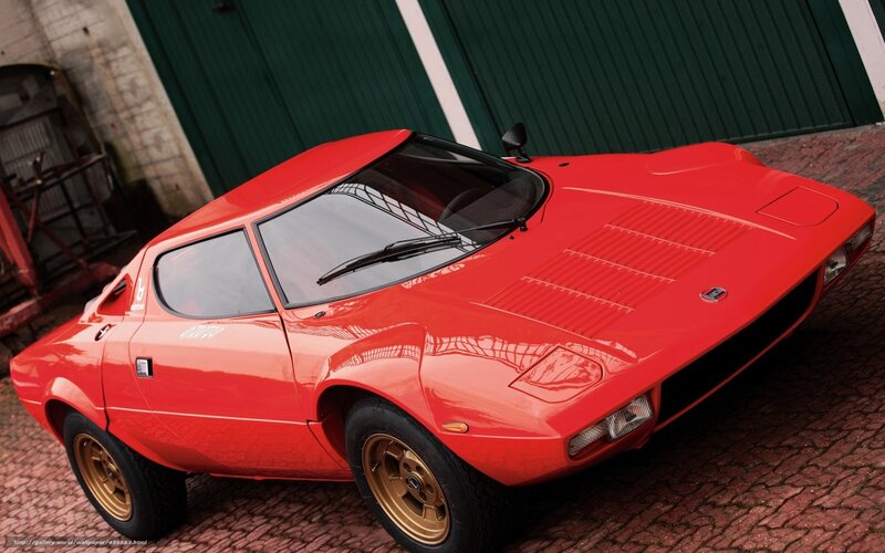 Red Sports Car — Dramatic, Photograph, Garage Door, Cobblestone